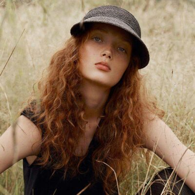 woman wearing a straw sun hat in the field