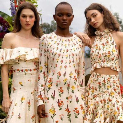 Three women beautiful wearing summer dresses outside in the park