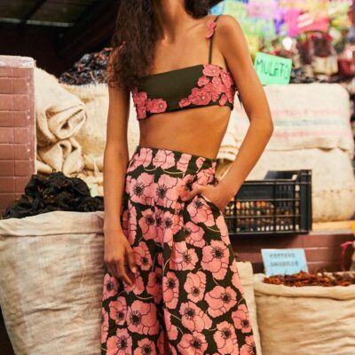 woman wearing a color print beach pants in the market